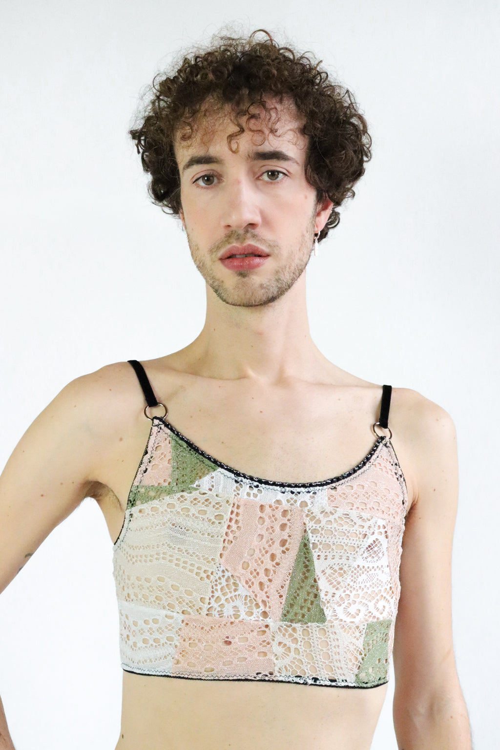 White, Pink and khaki unisex lace crop top with geometrical patterns, ajustable black velvet straps and silver hardware. Size Medium-Large.