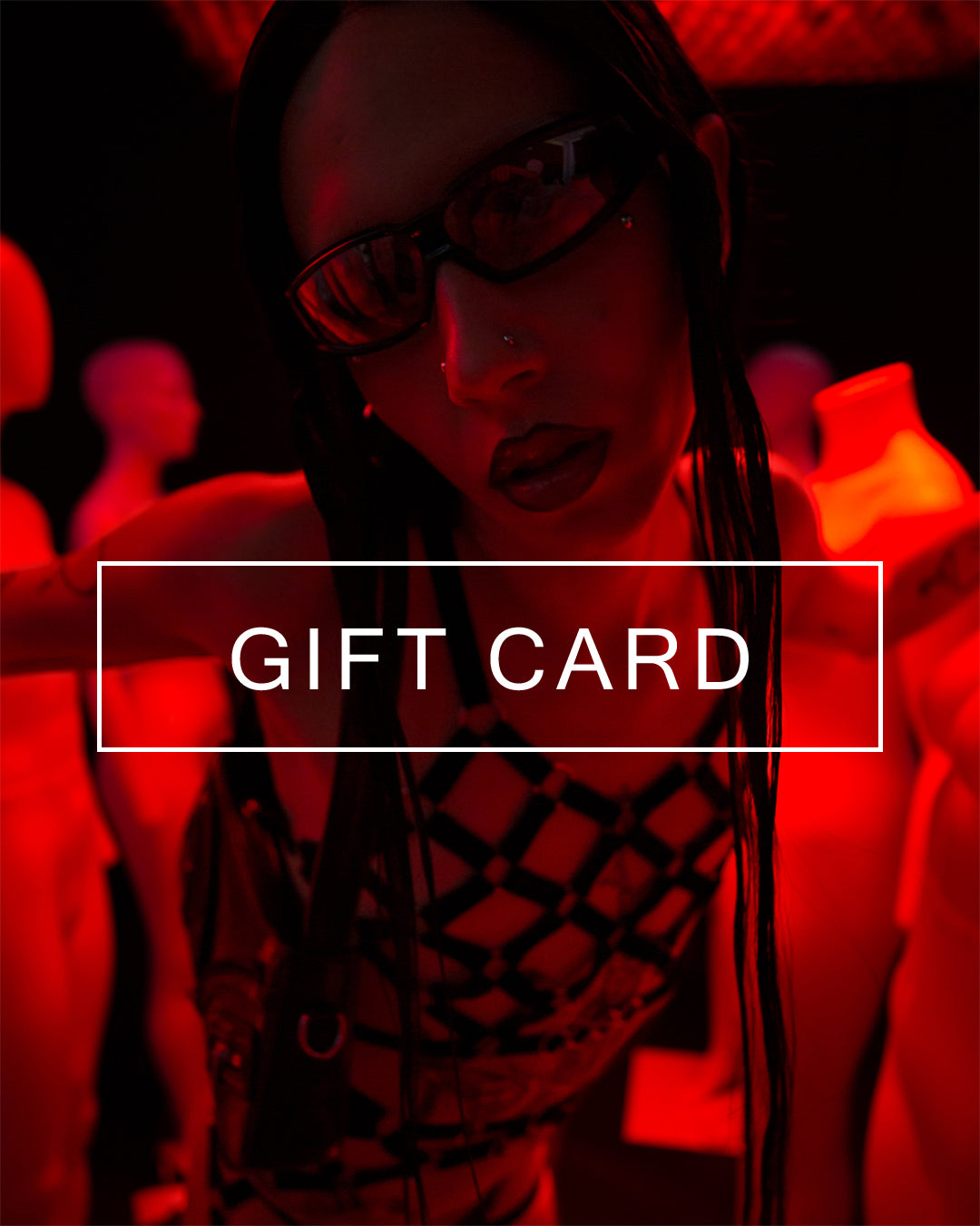 Digital Gift Card illustrated with a photo of a model posing in a black unisex cage design harness.