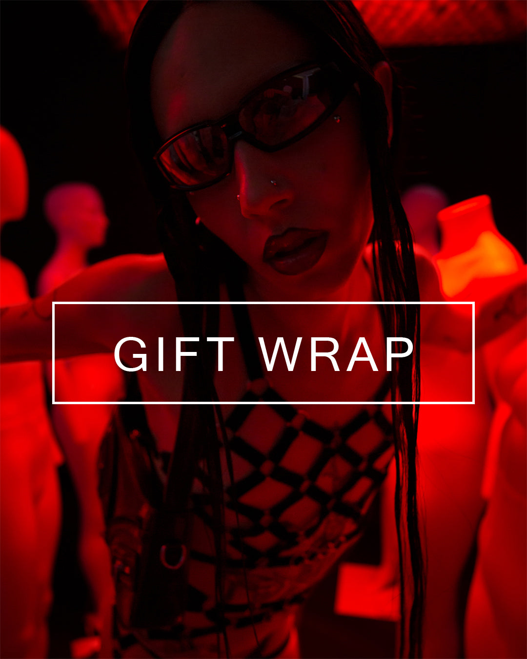 Wax-sealed branded packaging illustrated by a photo of a model posing in lingerie accessories.