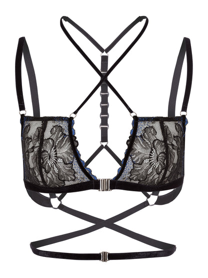 Front view of an adjustable bra made with floral black and blue lace, soft velvet straps across the chest and waist and a silver front closure.