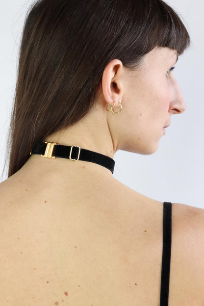 Back view of an adjustable black velvet choker with eco-friendly gold clasp.