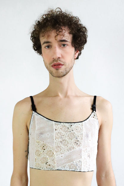 Unisex lace multiway crop top made of floral and geometrical patterned white lace, black velvet straps and gold hardware. Size medium large.