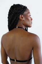 Load image into Gallery viewer, Back view of a woman wearing an adjustable chest harness with black velvet straps and gold hardware. Back closure with clasp.
