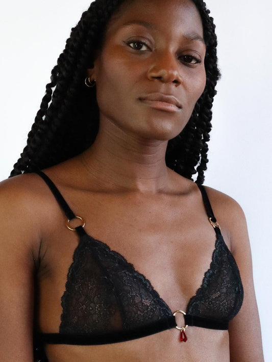 Black lace triangle bra with soft velvet straps, gold hardware and red crystal pendant