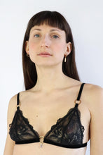 Load image into Gallery viewer, Woman wearing a bralette with black floral lace, gold hardware, and a transparent crystal pendant.

