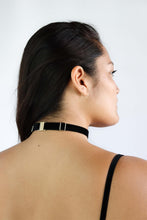 Load image into Gallery viewer, Back view of a woman wearing an adjustable black velvet choker with gold harware.
