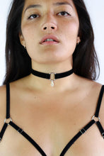 Load image into Gallery viewer, Woman wearing a black velvet choker with a silver O-ring pendant and clear crystal.
